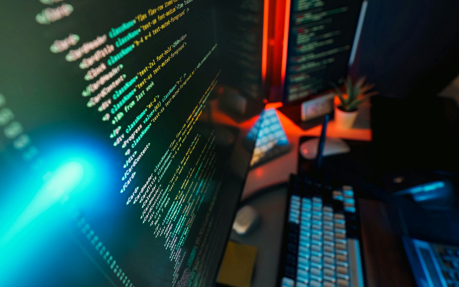 Developer workspace with code on screen in warm ambient light
